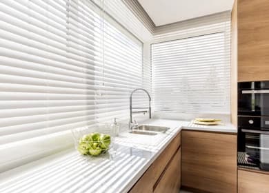 White venetian blinds in a kitchen