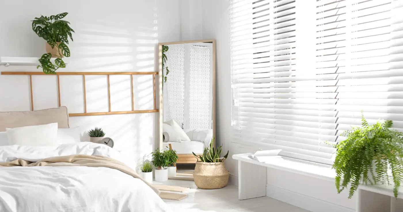 Bright bedroom with venetian blinds